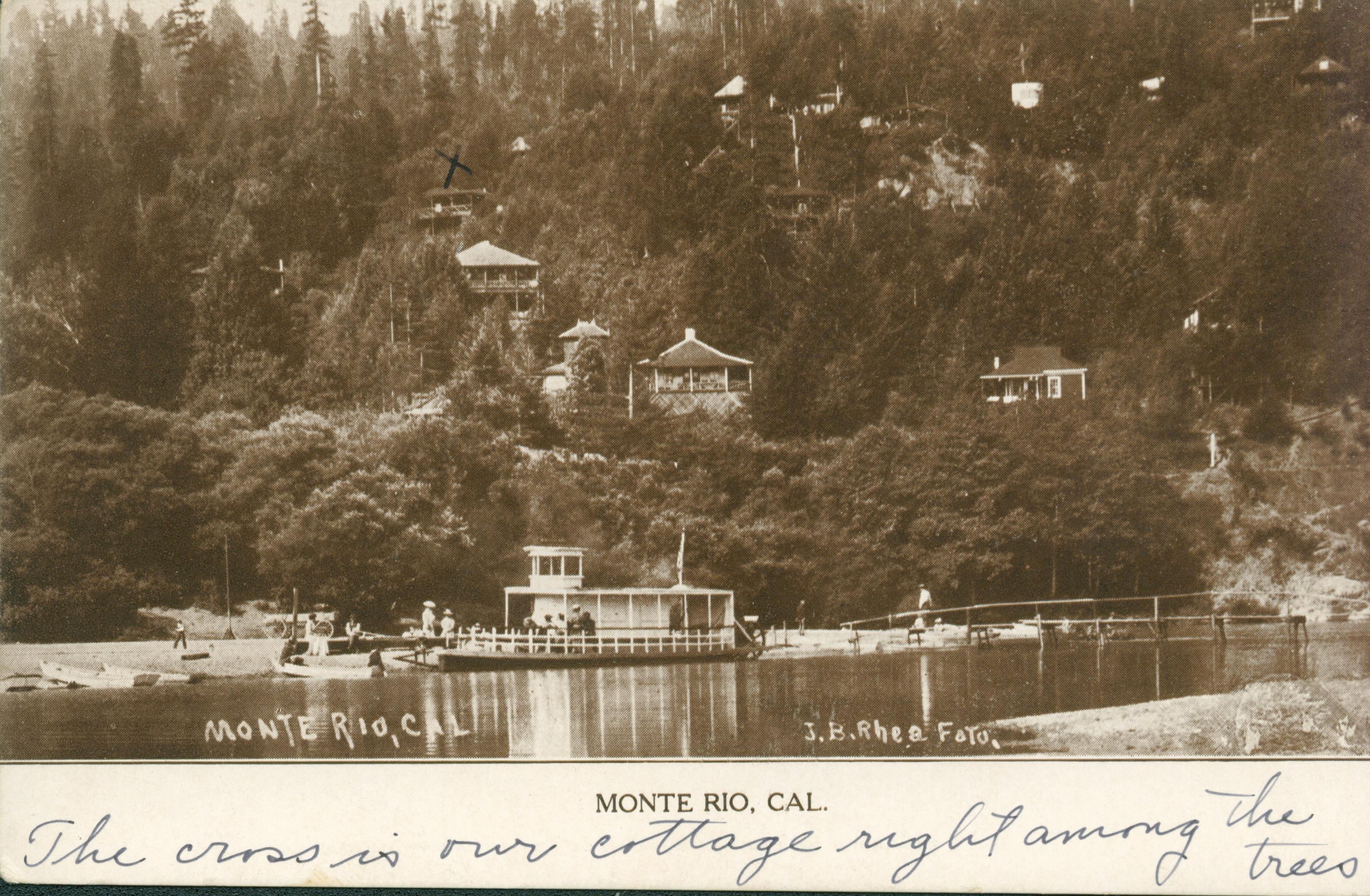 Shows the Russian river with a beach, ferry, and Monte Rio on the far side.